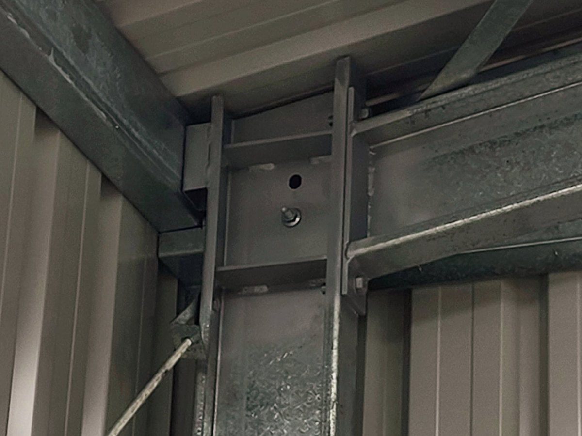 Welded steel knee plate and bolted portal frame connection inside a Spartan Sheds™ shed