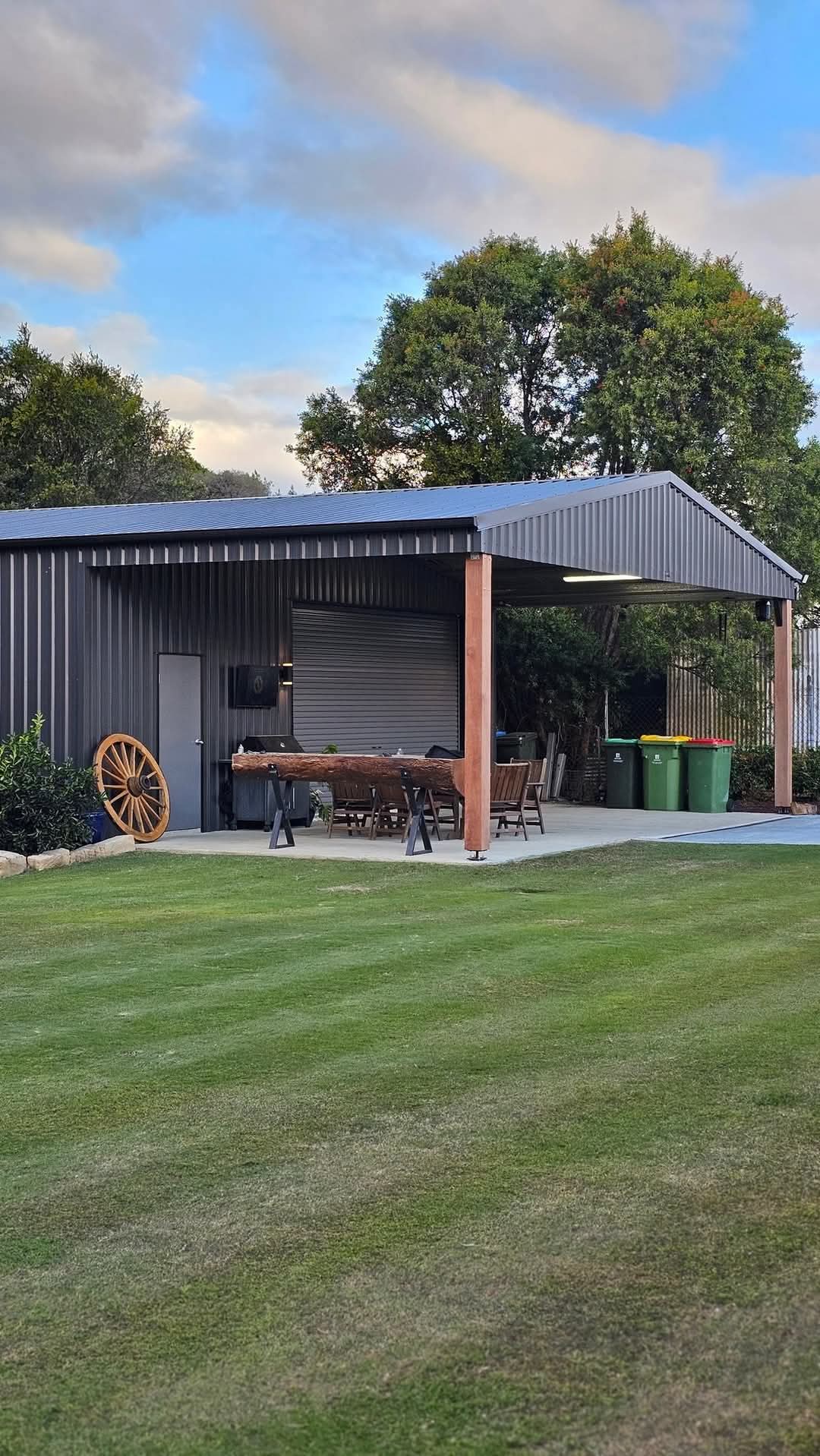 Custom residential garage with attached carport in COLORBOND® steel, built by Spartan Sheds™ in Bundaberg