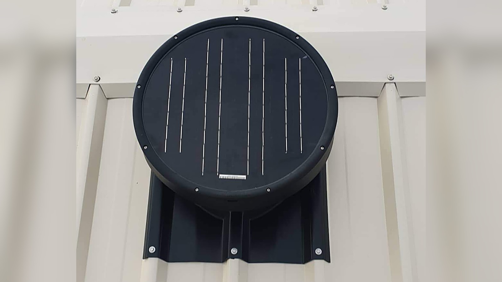 Solar-powered roof ventilator with charcoal flashing fitted to a cream COLORBOND steel shed roof by Spartan Sheds in Bundaberg QLD